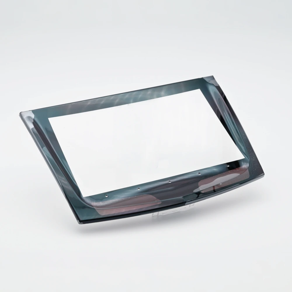 Automotive control panel lens manufactured using IMD (In-Mold Decoration) plastic molding technology for seamless graphic integration and high optical clarity.