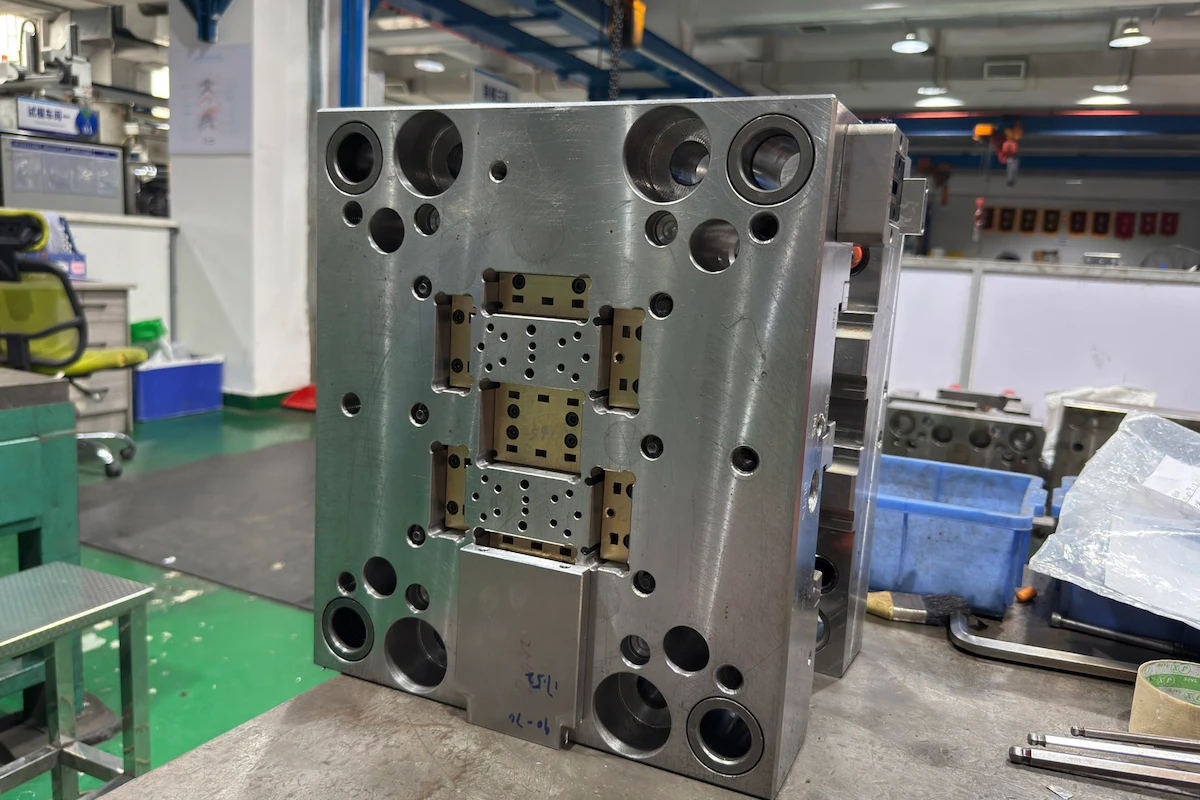 Mold cavity block showing drilled cooling channel ports