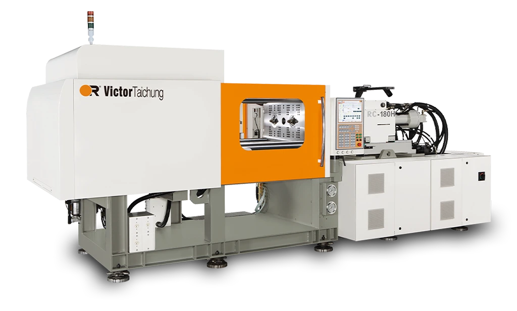 Two-shot injection molding machine with dual barrels on a production floor