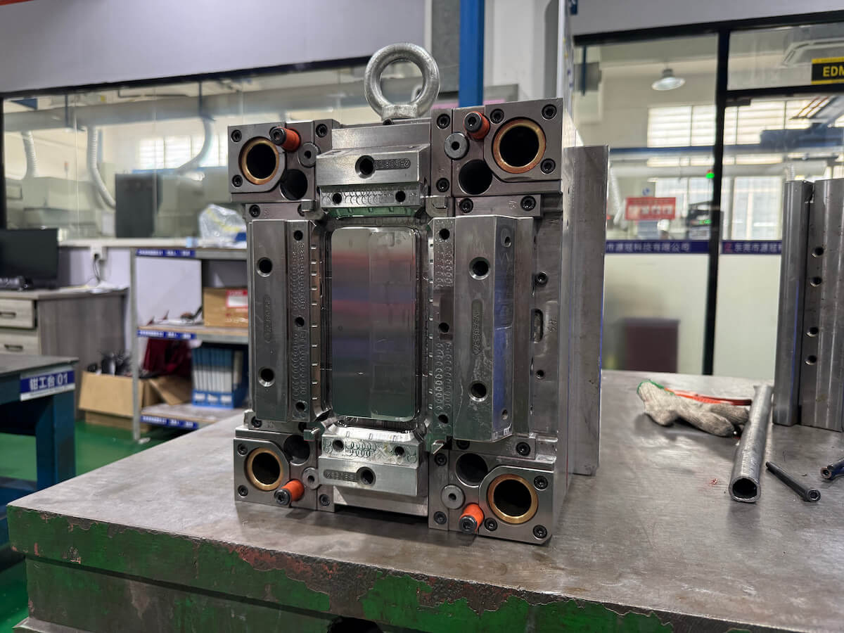 An aluminum rapid tooling mold insert on a workbench
