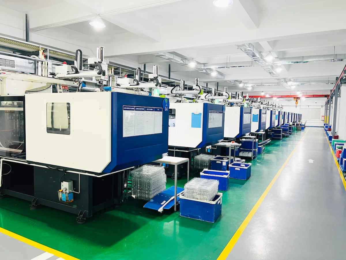 YG Tech injection molding factory floor with multiple presses running