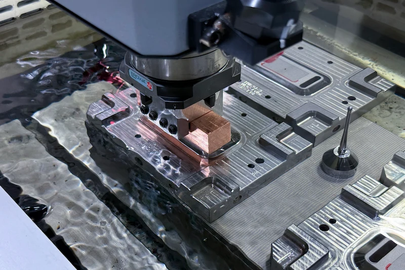 Mirror EDM spark erosion machine working on a mold detail