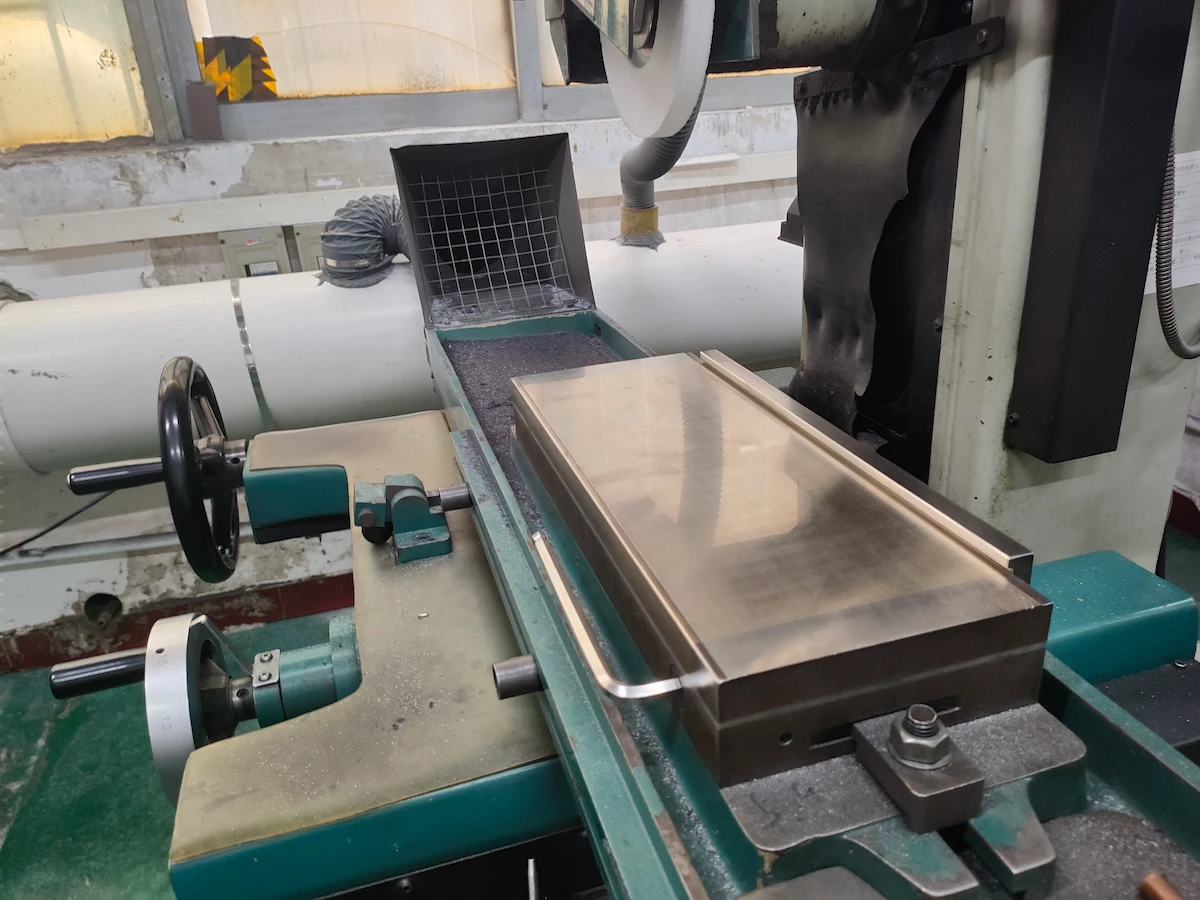 Toolmaker reworking and polishing injection mold steel