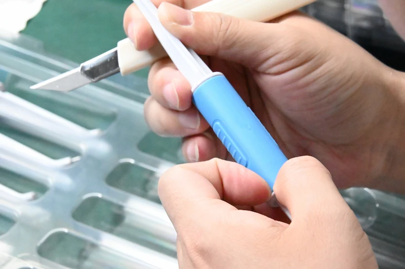 Overmolded soft-touch plastic part sample with TPE grip