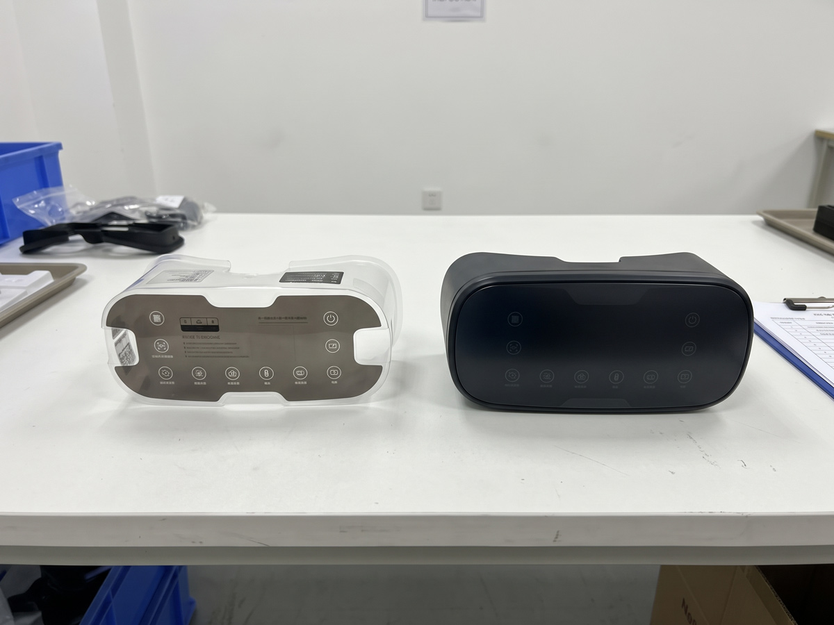 In-Mold Decoration IMD film strip next to a finished injection-molded smart device front panel with integrated touch icons
