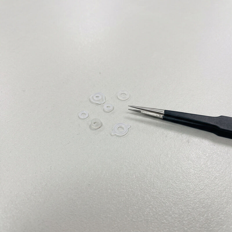Micro LSR molded parts such as small acoustic seals and medical micro valves