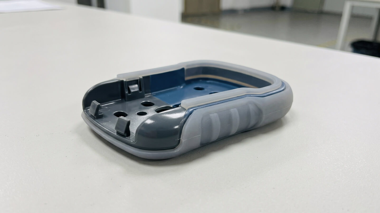 LSR overmolded onto a PPS structural insert for an AR/VR device component